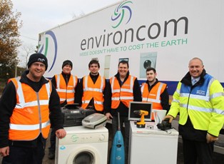 Mark Deerfrom Suffolk county council (right) with FCC Environment team at the Foxhall HWRC in Ipswich